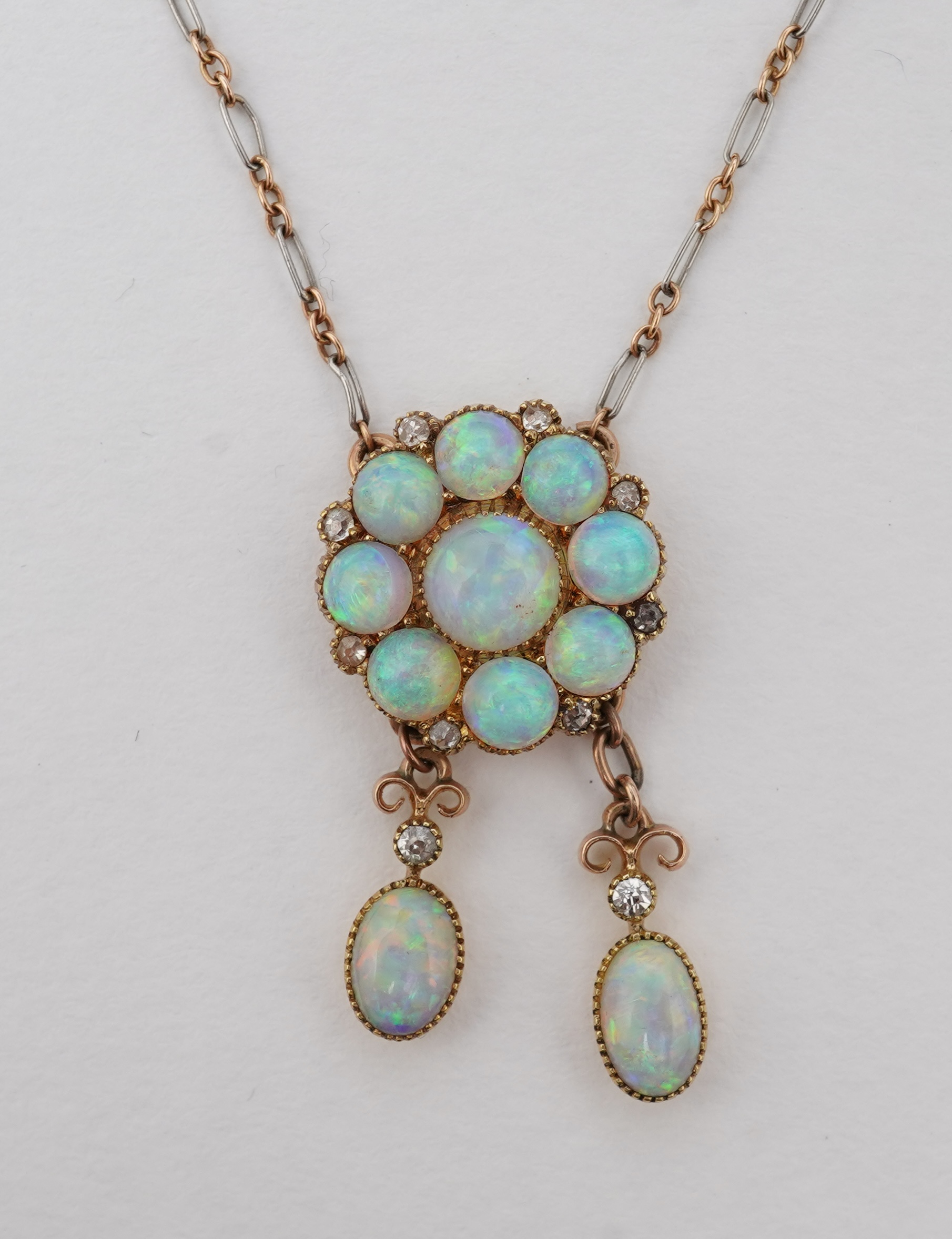 An attractive Edwardian opal and diamond demi-parure, early 20th century